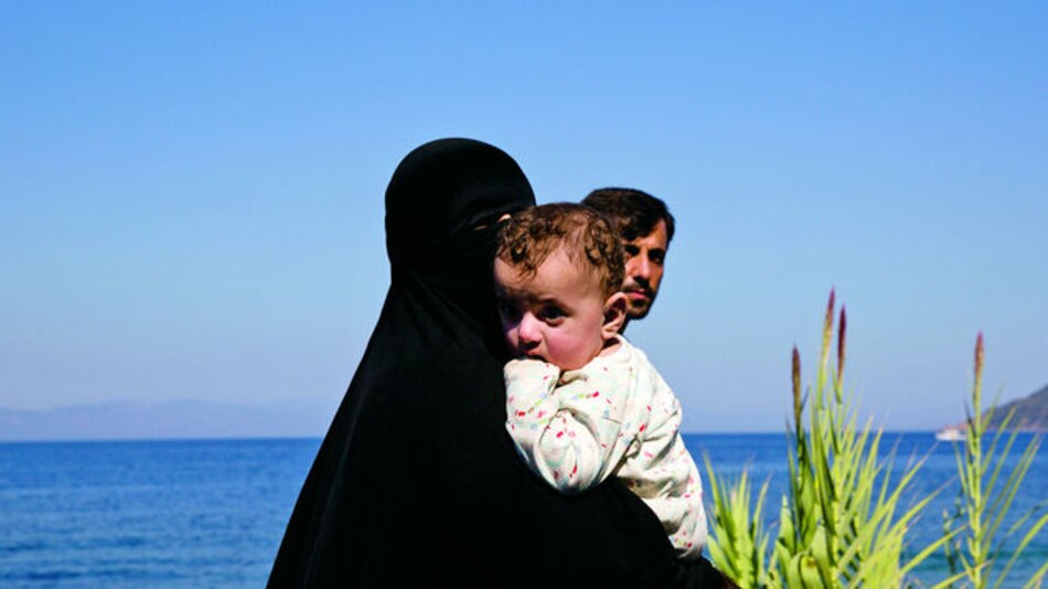 Niño muerto en la playa
