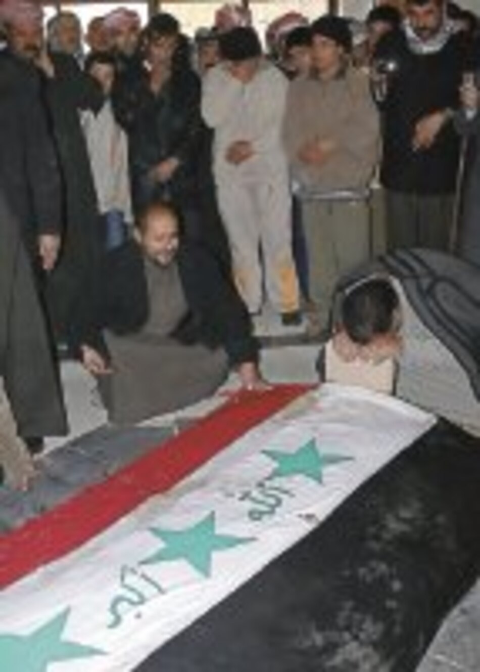 Entierran a Sadam Hussein junto a sus hijos