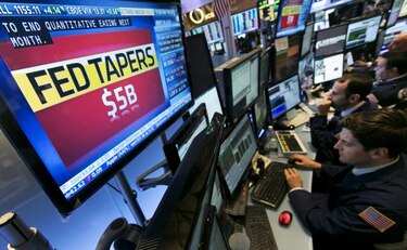 Fed mantiene tasas; concluye la compra de bonos