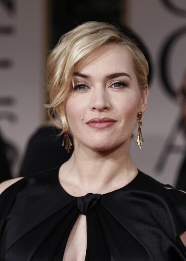 Kate Winslet y Kenneth Branagh, condecorados por Isabel II