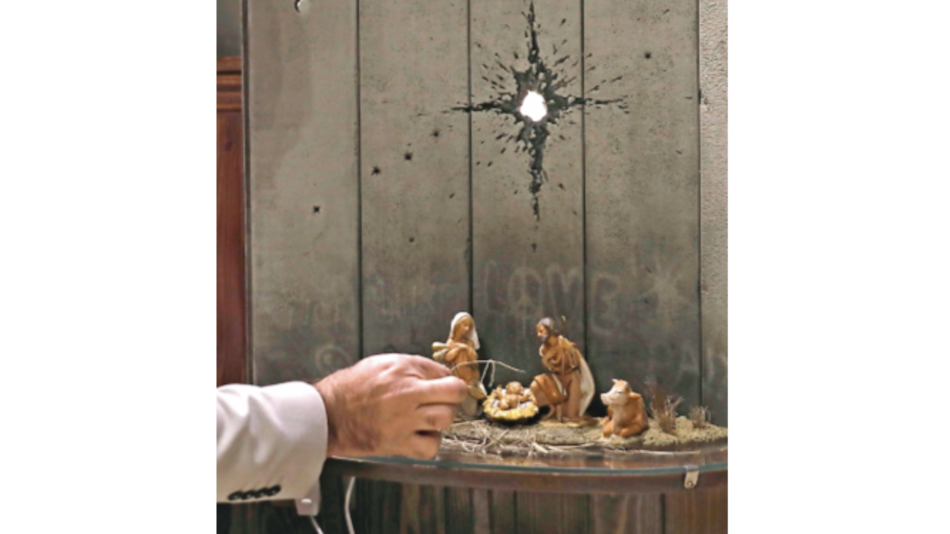 El nacimiento de Banksy con un disparo y un muro fronterizo